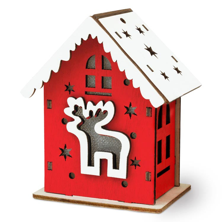 Rotes Adventshaus aus Holz mit Hirsch