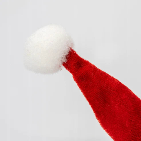 Eine singende Weihnachtsmannmütze, die mit Musik spielt