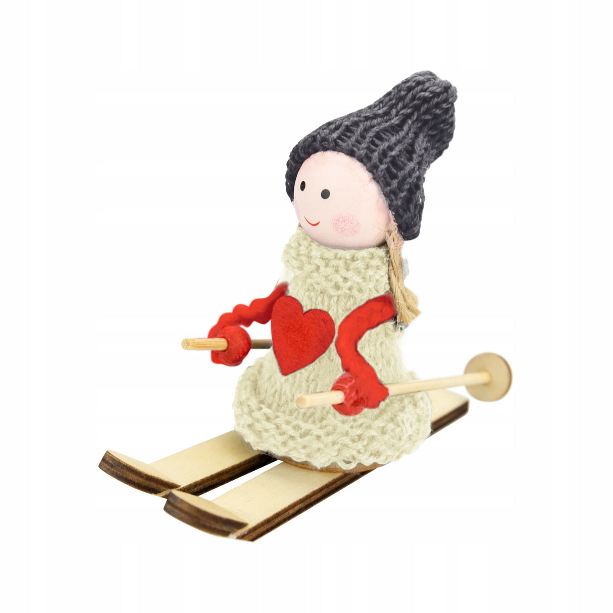 Weihnachtsfigur eines Mädchens auf Skiern