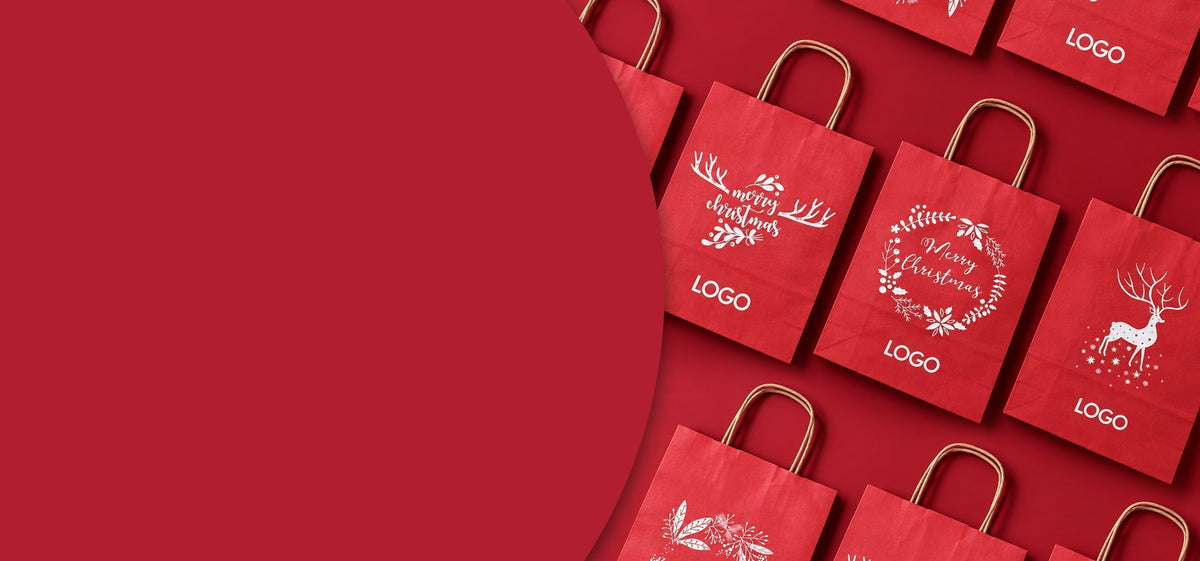Rote Weihnachts-Papiertragetaschen mit weihnachtlichen Motiven und Ihrem Logo