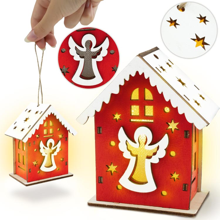 Rotes Adventshaus aus Holz mit Engel