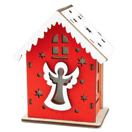 Rotes Adventshaus aus Holz mit Engel
