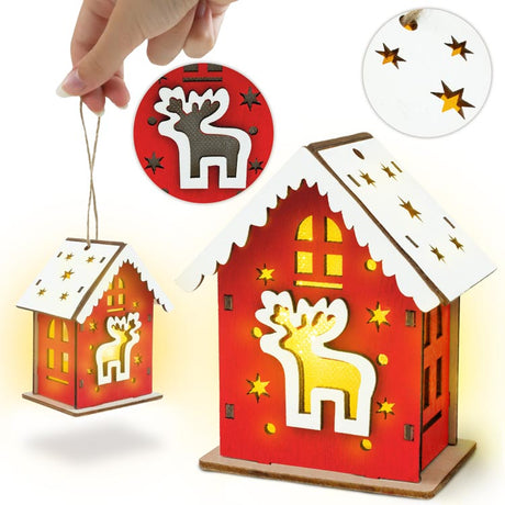 Rotes Adventshaus aus Holz mit Hirsch