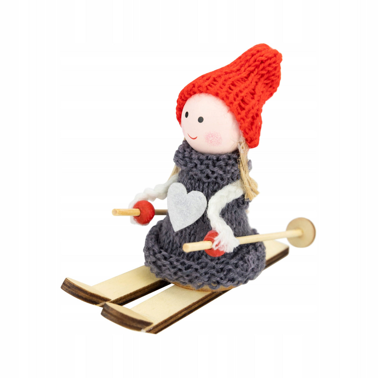 Weihnachtsfigur eines Mädchens auf Skiern