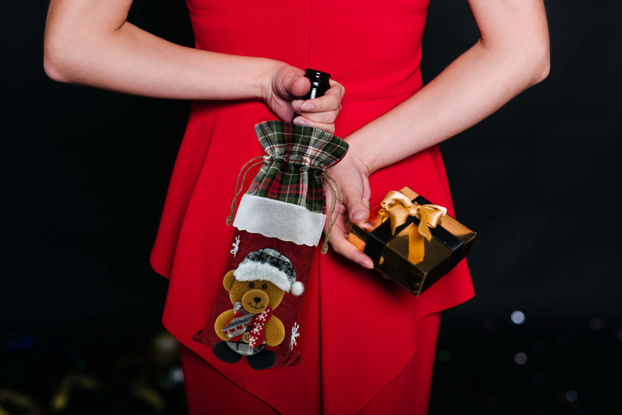 Weihnachtskostüm für einen flaschenroten Teddybären